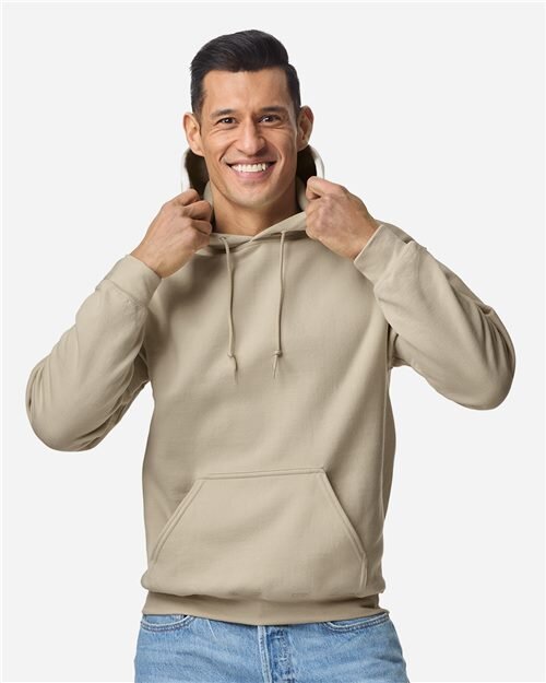 Model in a blank sand-colored Gildan 18500 pullover hoodie