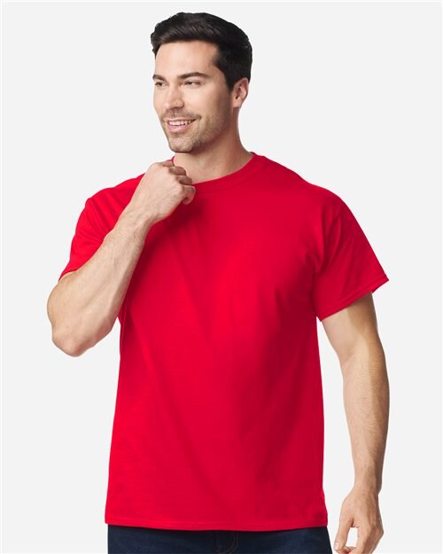 Model wearing a blank red Gildan 5000 heavy cotton t-shirt